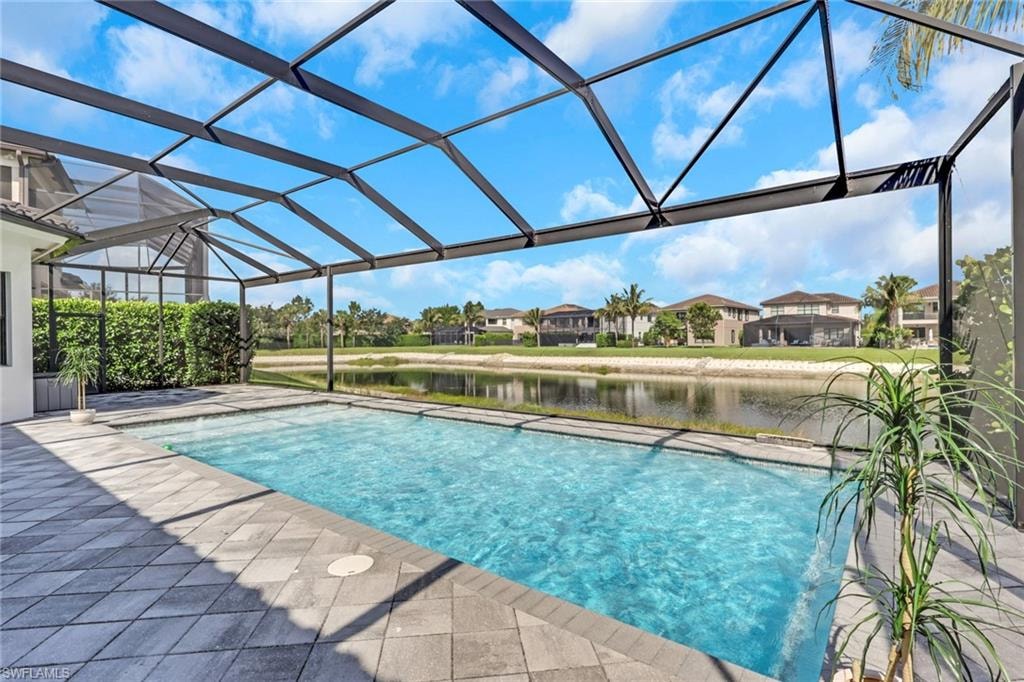 Large, enclosed lanai with heated pool and gorgeous lake view! Great space for entertaining or relaxing by the pool enjoying the lake view.