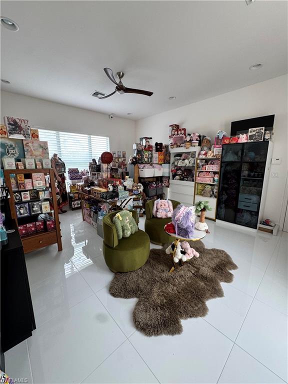 "Club Room" or large rec room, bonus room with its own private entrance at the front of the home with access to the garage.