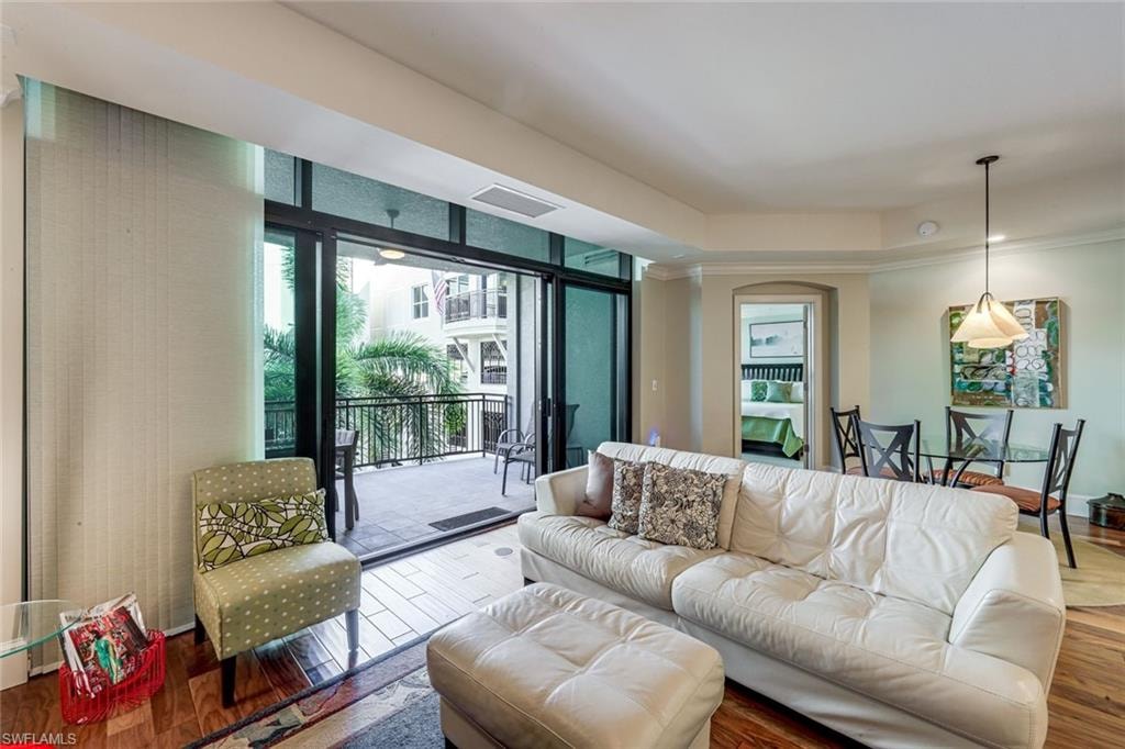 Hardwood-finish flooring extending from the living area to a private balcony