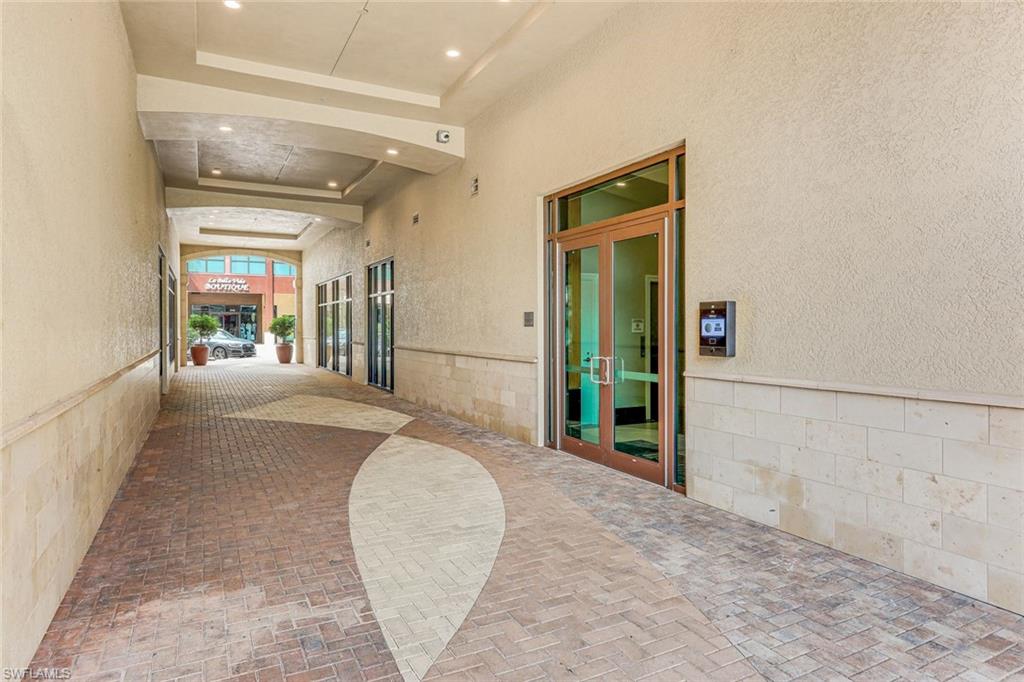 Covered entryway featuring recessed lighting and a textured wall finish
