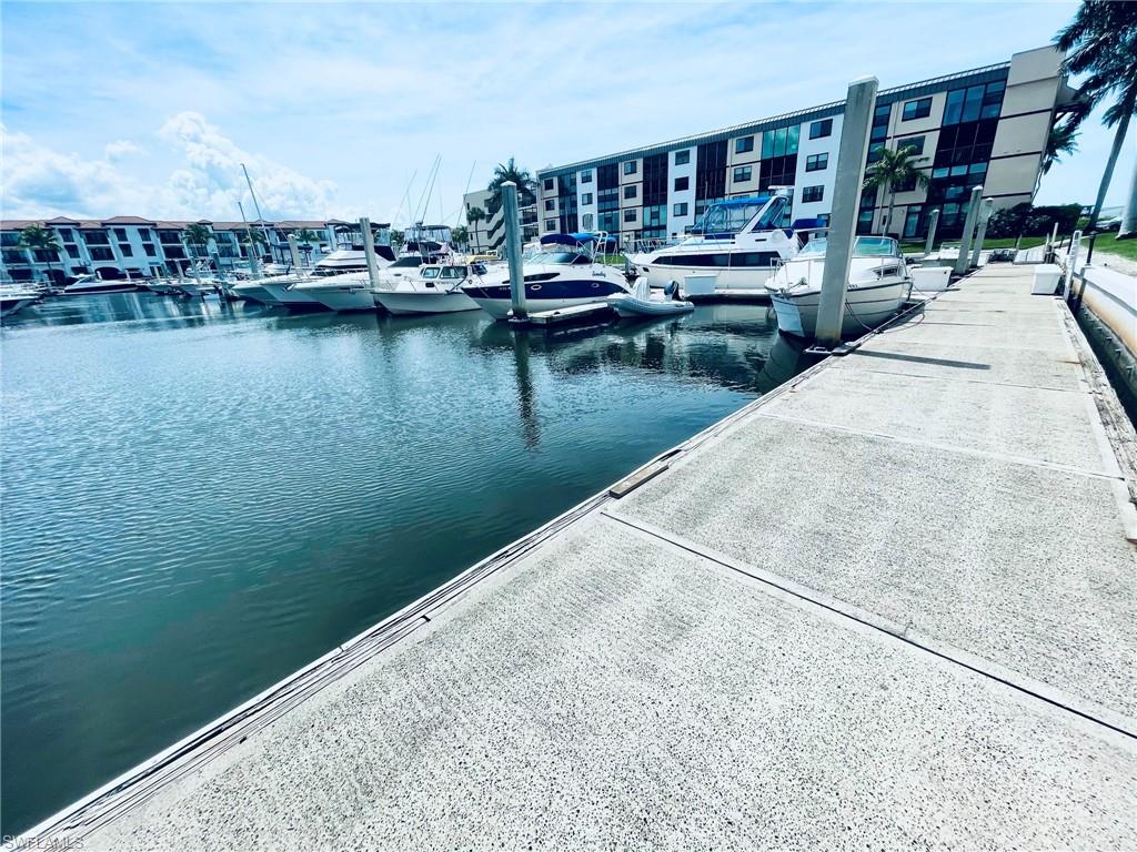 Waterfront marina featuring multiple boat slips