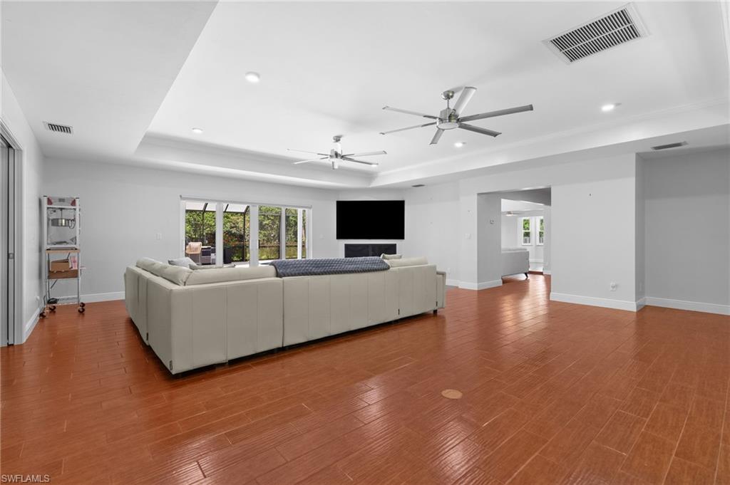Large living room with tray ceiling