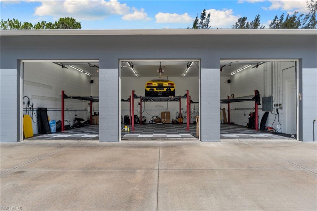 three newly installed high-capacity, industrial aluminum vehicle lifts to effortlessly house 6 cars.