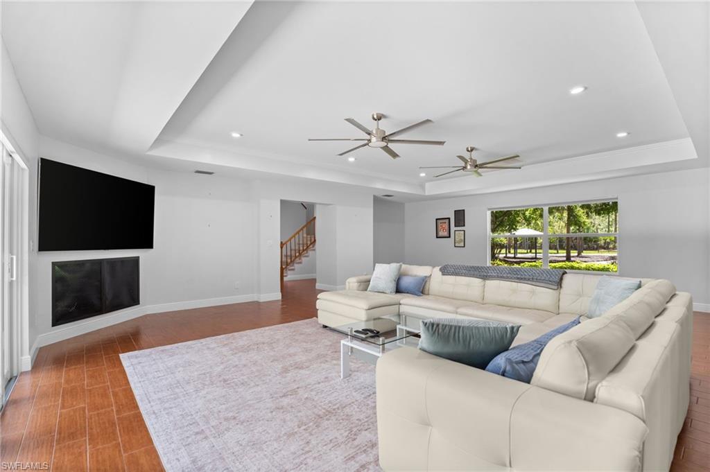 Large living room with tray ceiling