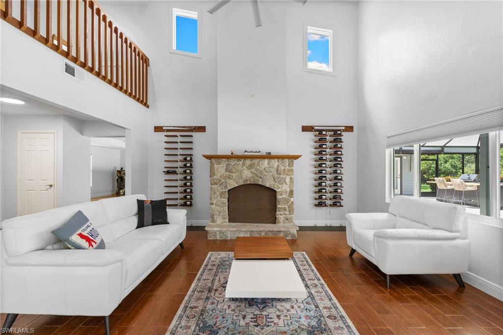 Living room with fire place and loft