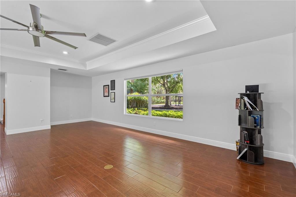 Large living room with tray ceiling