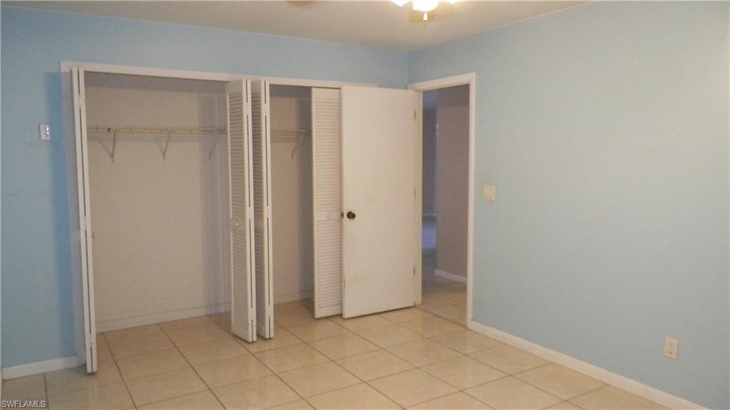 Interior room featuring ceramic tile flooring and light blue wall paint