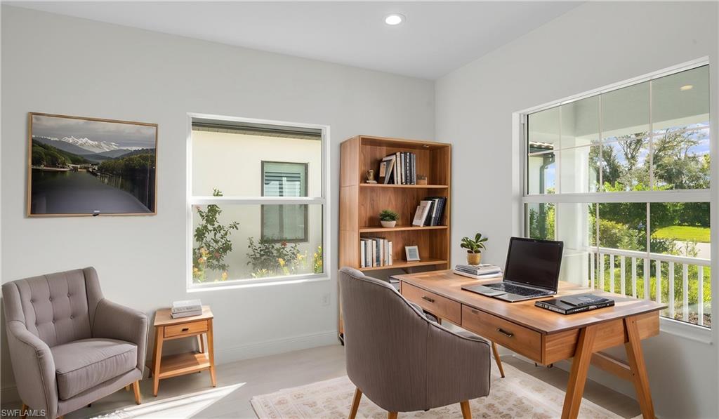 Located just off the foyer behind elegant double doors, this dedicated den offers the ideal setting for a home office, library, hobby room, or media space. Large windows bring in natural light while the quiet location provides privacy when working remotely or managing daily tasks.