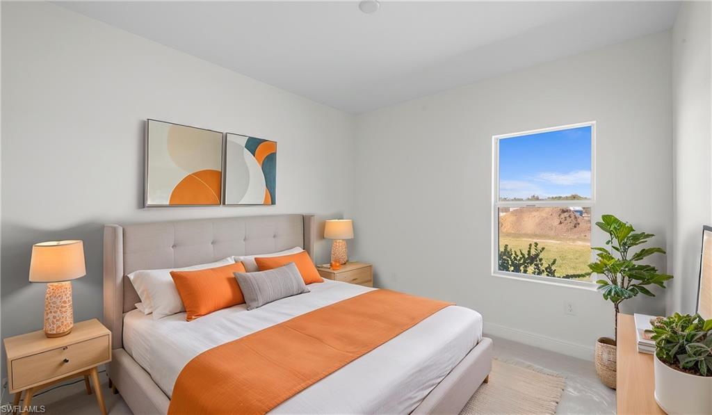 Bright room featuring a window with natural light, neutral wall colors, and light-toned flooring