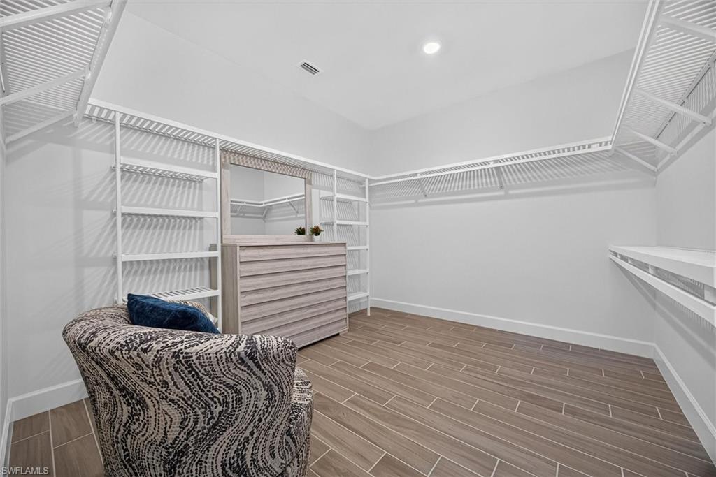Dream closet in the owners suite with extensive storage and generous hanging place