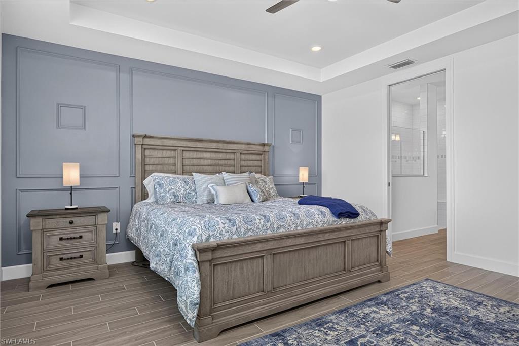 Large owners bedroom with dimensional accent wall