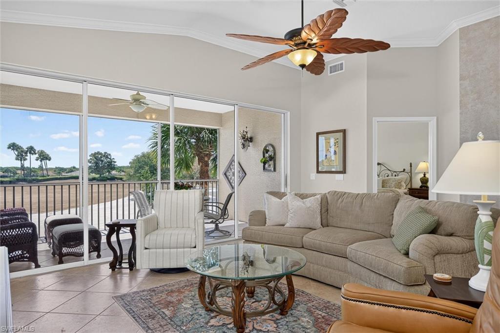 Living area featuring a screened patio overlooking a natural landscape