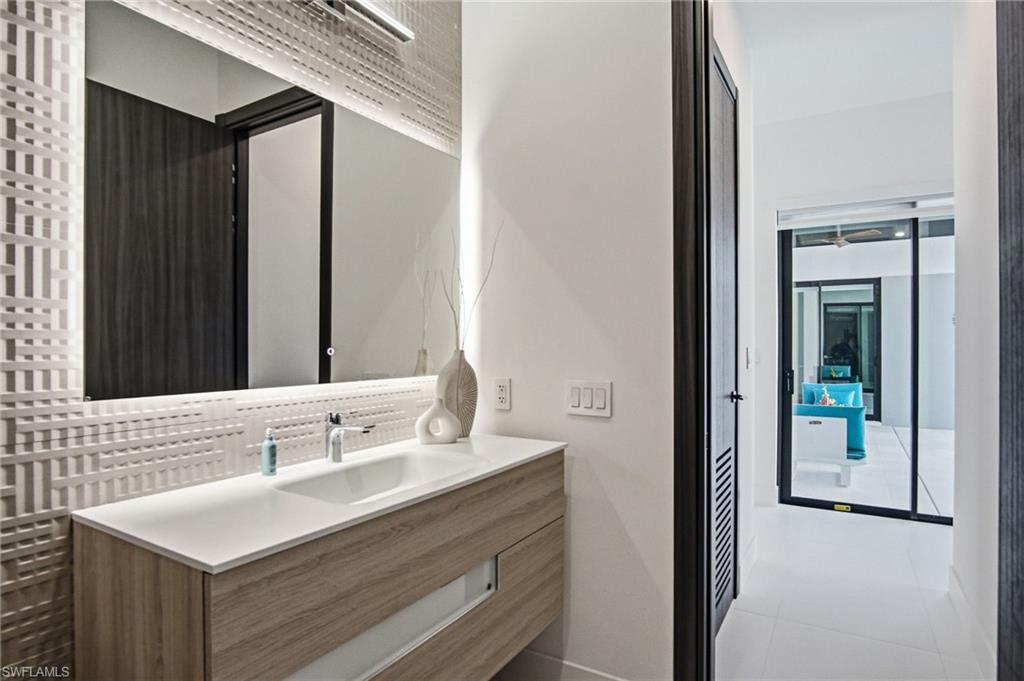Floating wood-finish vanity with an integrated rectangular sink