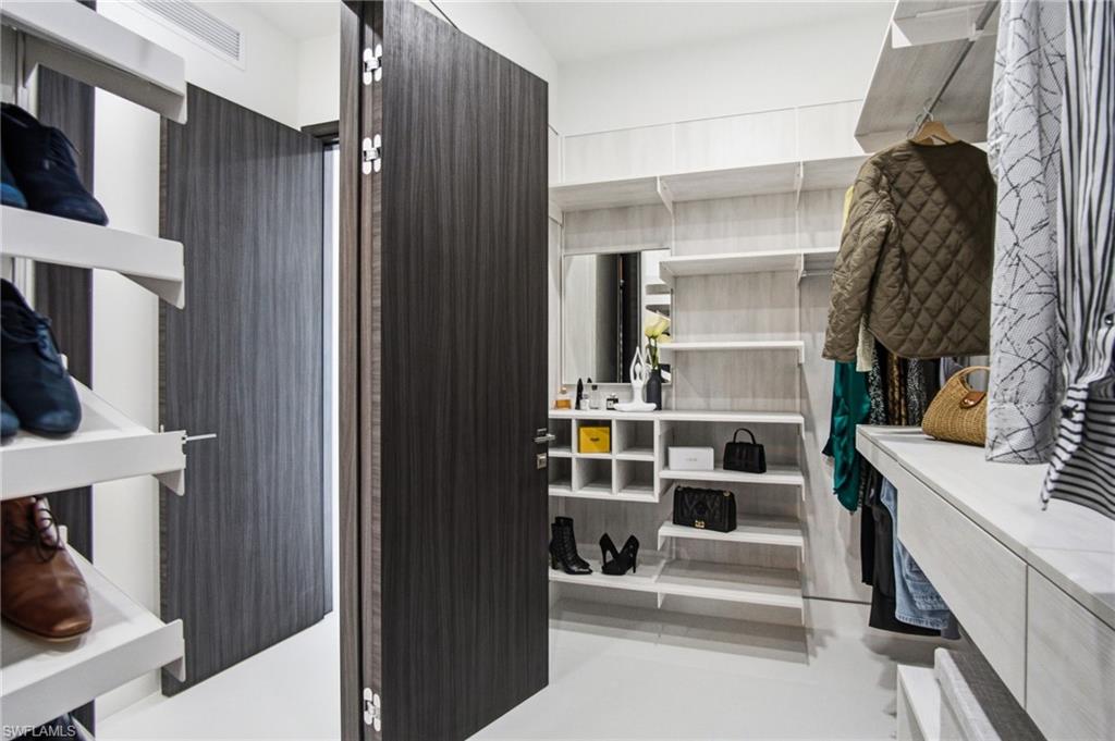Customizable closet system featuring extensive shelving, hanging space, and integrated cubbies