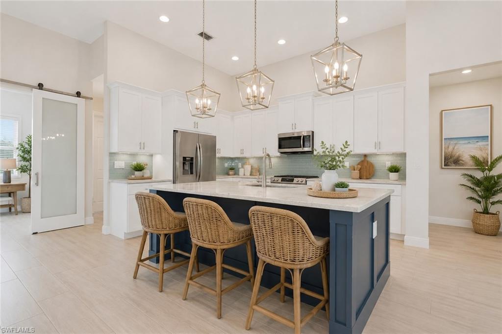 Island kitchen with granite counters, classic white shaker style cabinets with crown molding and crown molding. Virtually staged.