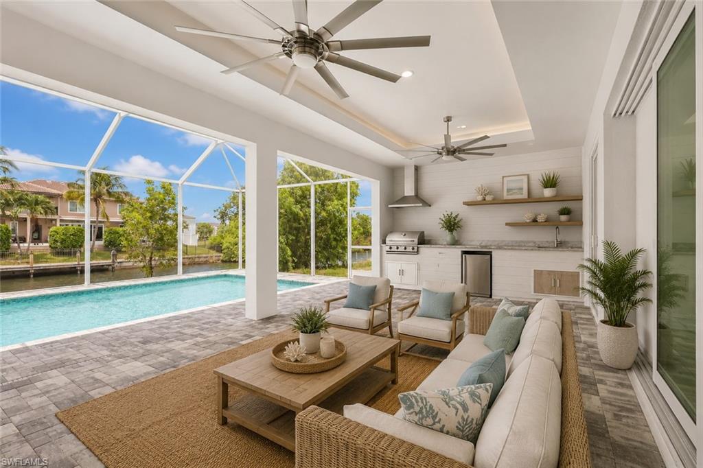 15' deep by 38' long under truss lanai with summer kitchen. Virtual staged