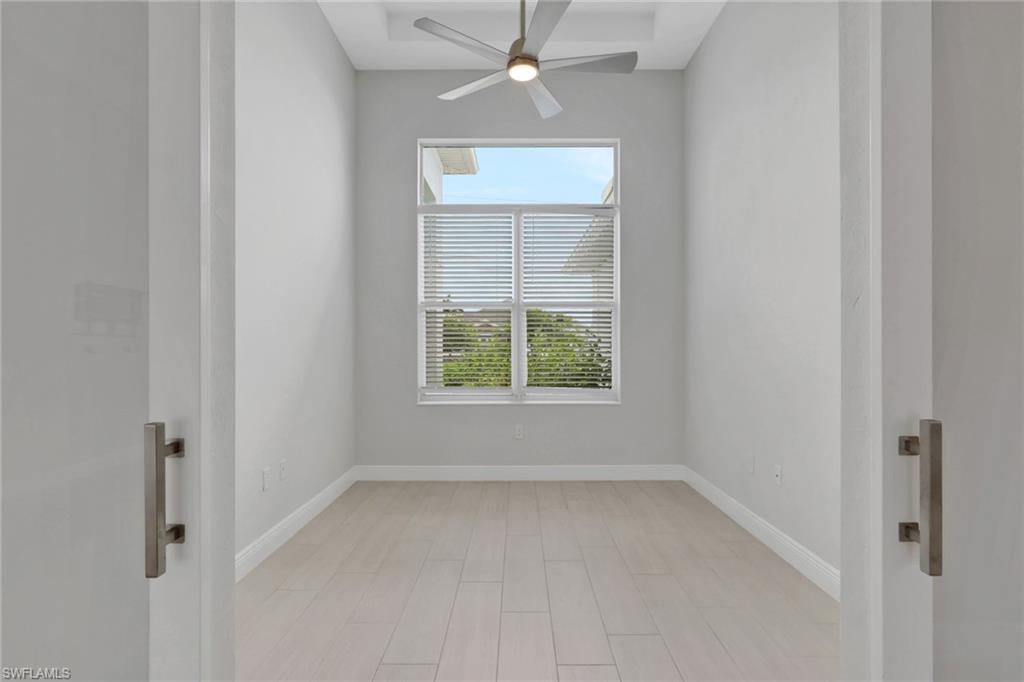 office/den with glass bar doors
