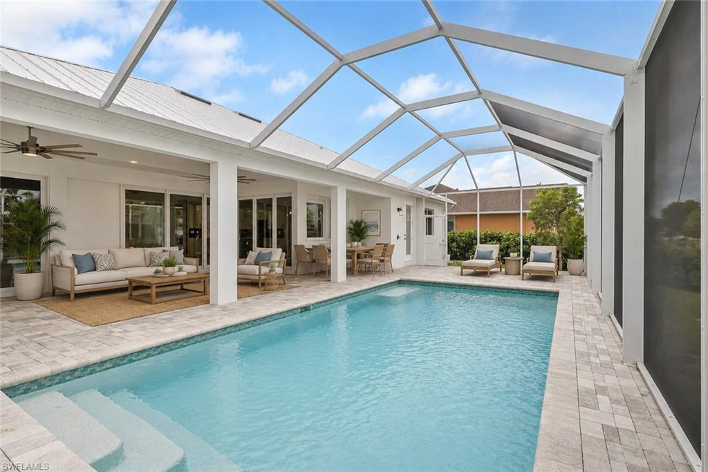 virtually staged, large 13' by 27' heated pool on 20' by 46" lanai