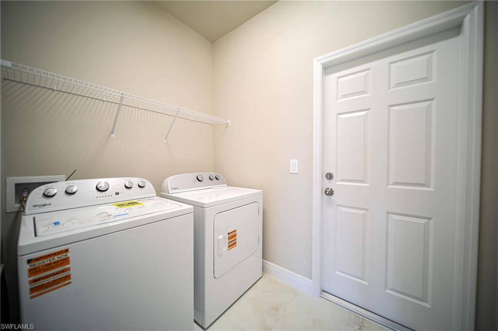 Brand New Washer And Dryer And Metal Shelving In The Laundry Room!