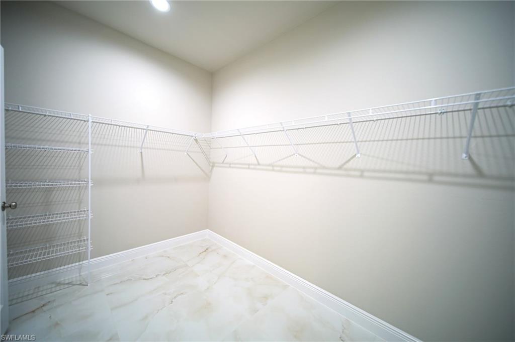 The Oversized Master Bedroom Closet Comes With All Wall Shelving And A Shoe Wall!