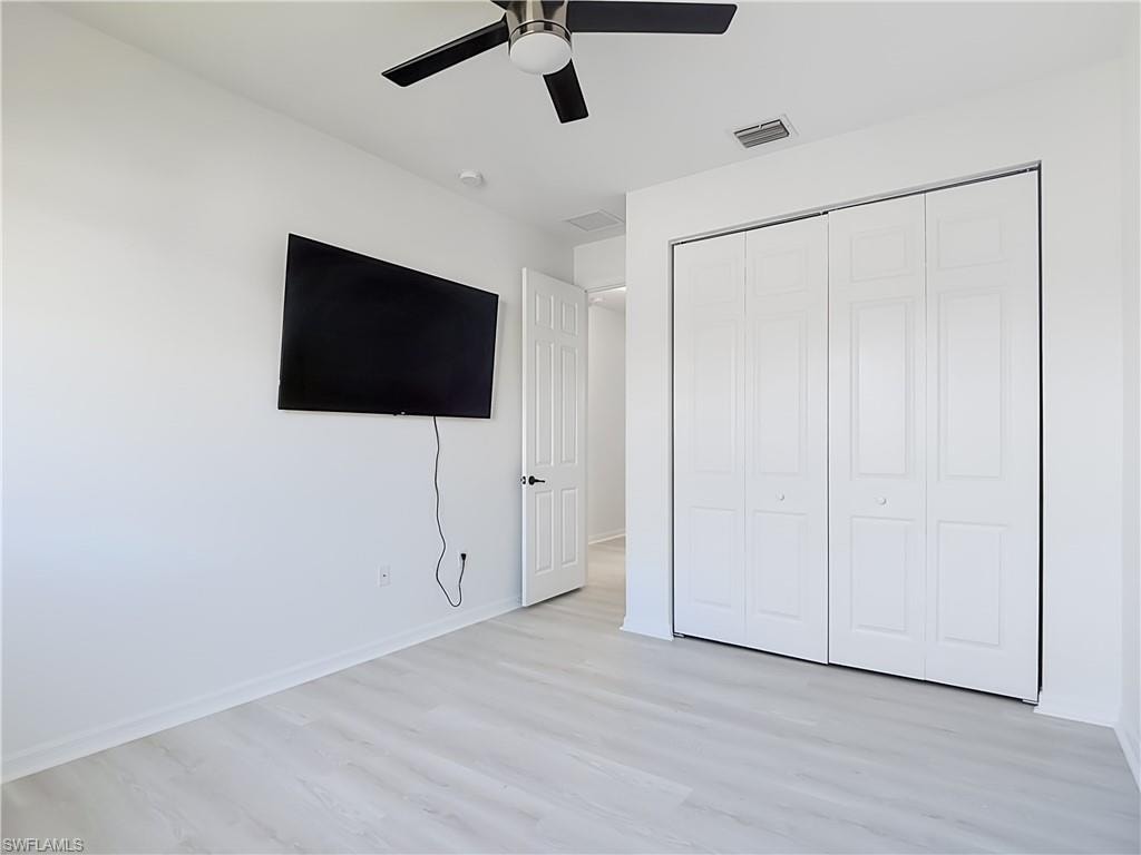 Bright interior room featuring light wood-finish flooring