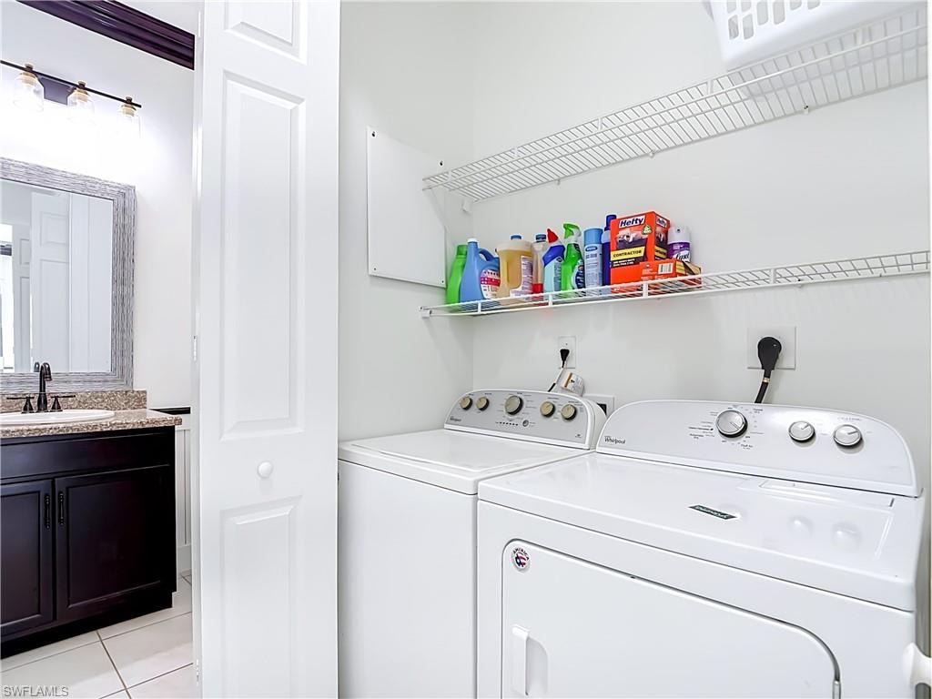 Dedicated laundry area featuring a white washer and dryer, paired with white wire shelving for organized storage