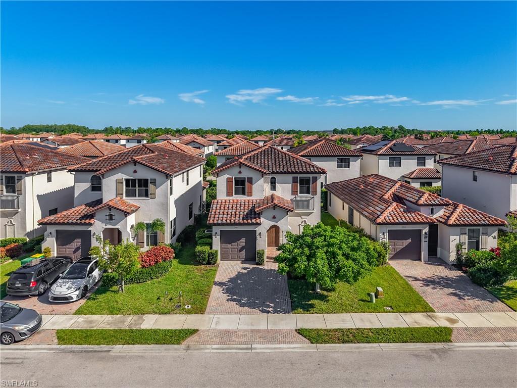 Mediterranean-style residence featuring a terracotta tile roof and stucco exterior