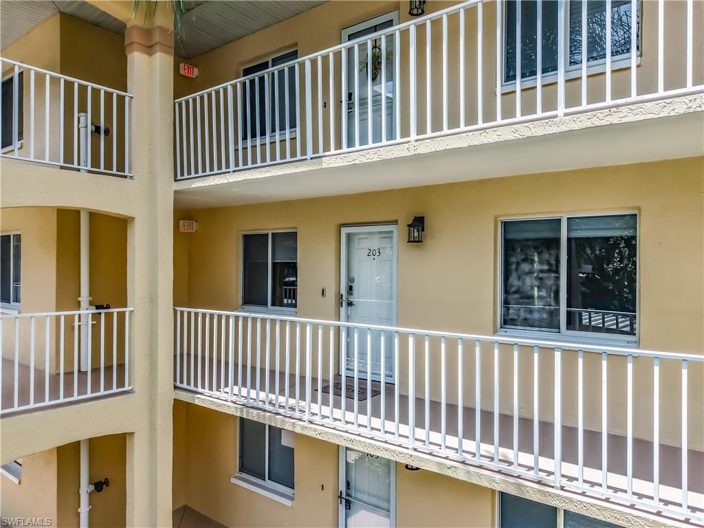 Multi-story residential building with stucco exterior