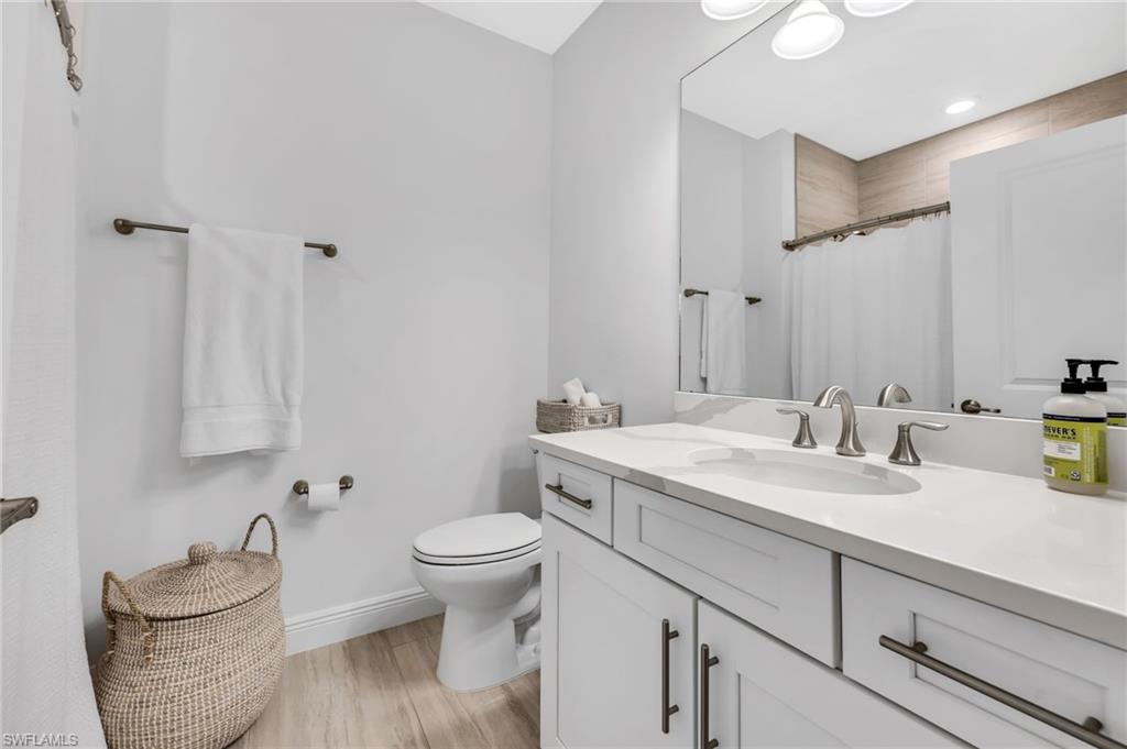 Vanity with a white countertop and dual undermount sinks
