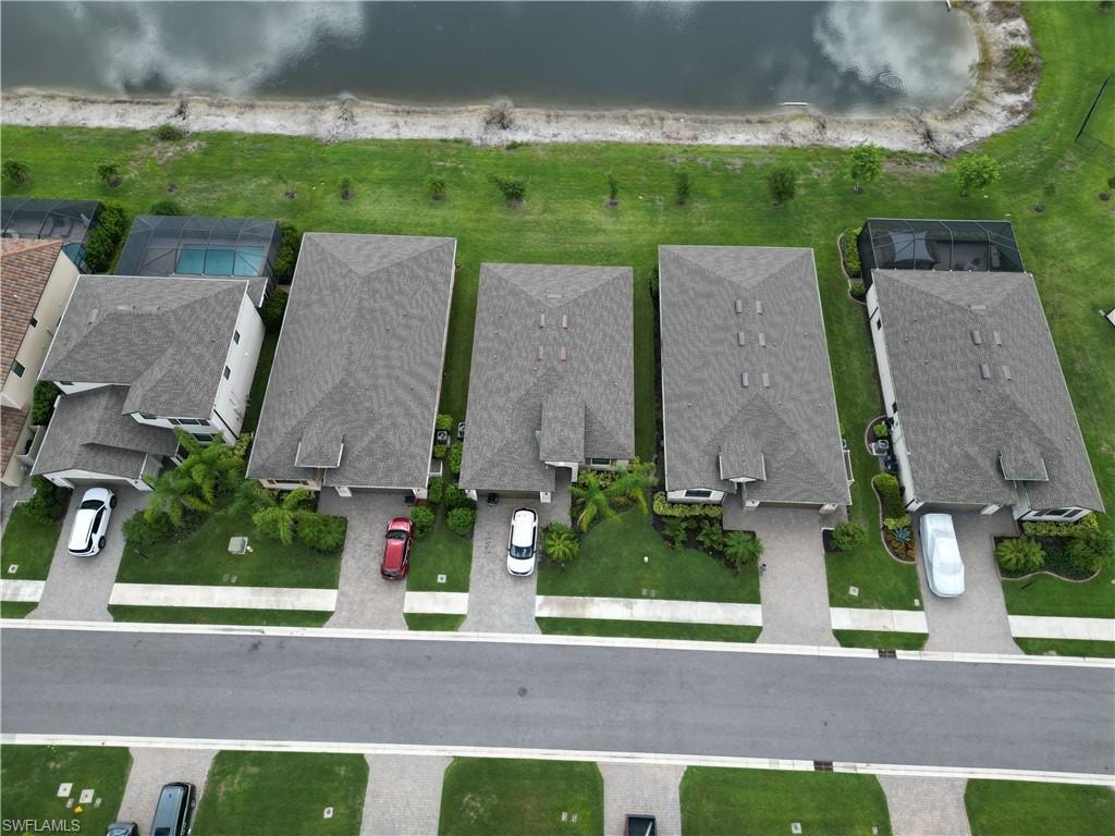 Aerial perspective showcasing a row of residential properties with varied rooflines