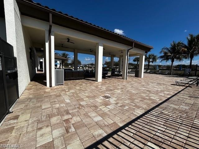 Spacious covered patio with a paver surface