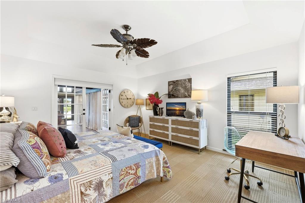 Primary bedroom with spacious layout and direct access to sunroom/Florida room