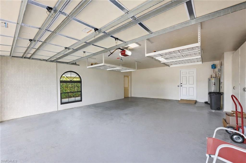 Spacious garage with extended storage and room for multiple vehicles, workshop setup, or accessible entry transition