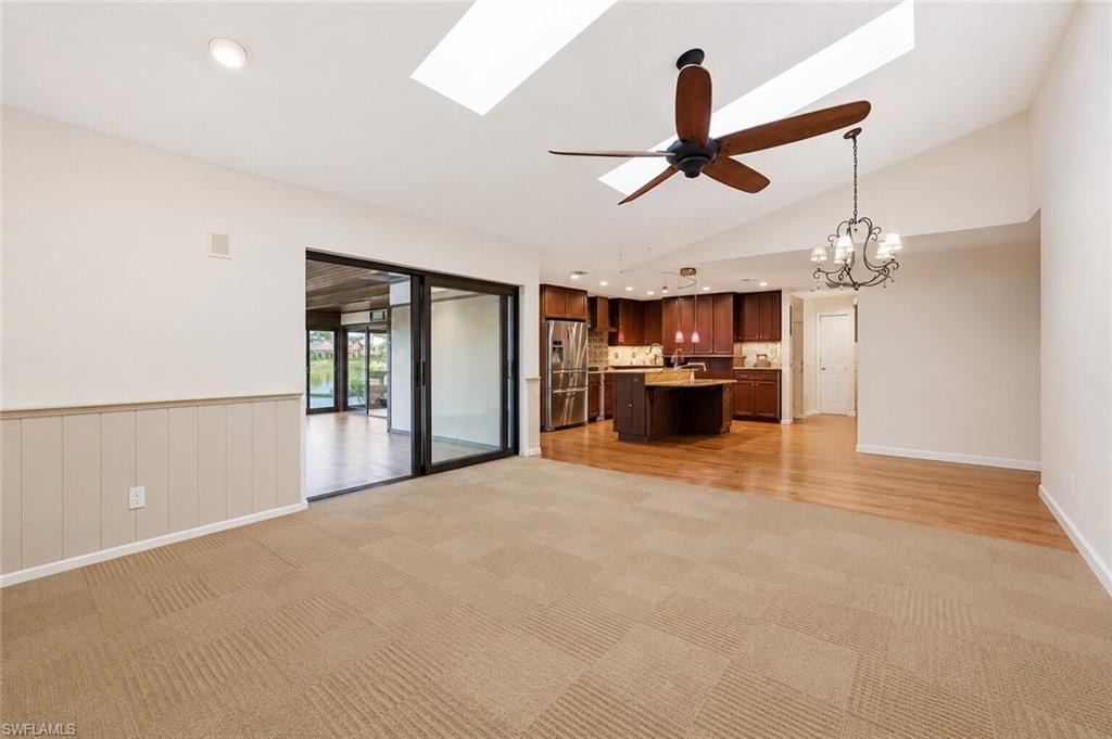Family room with access to sunroom and kitchen (ai generated to remove furniture)