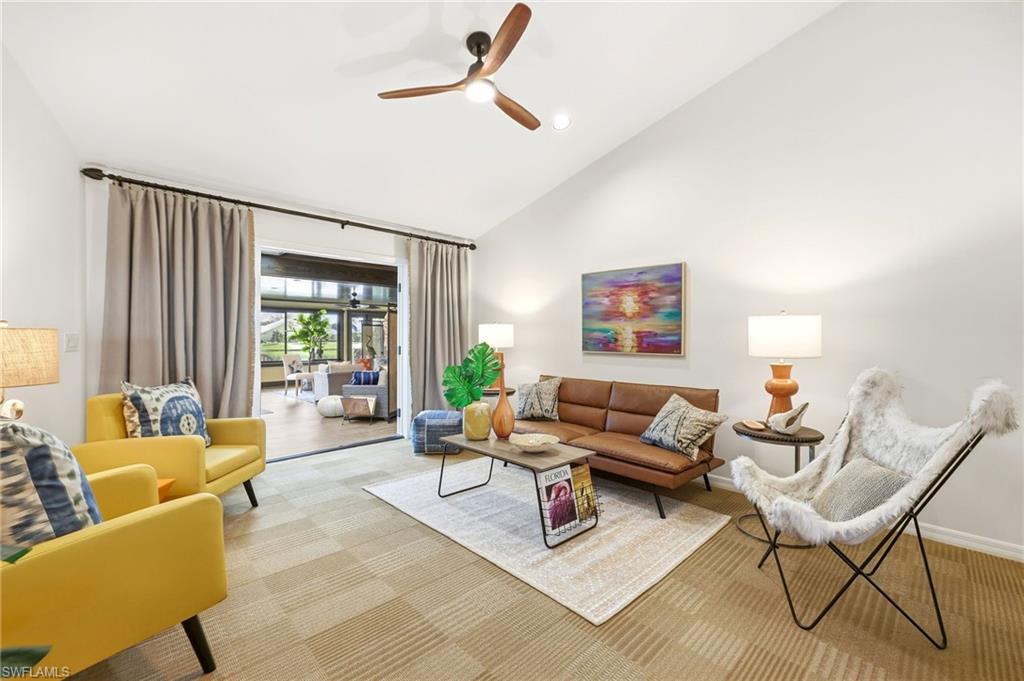 Living room with vaulted ceilings and open layout, designed for easy movement and comfortable everyday living