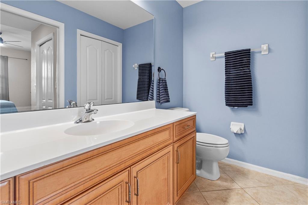 Primary bathroom featuring a wood-finish vanity
