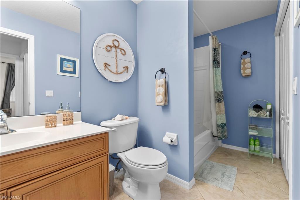 Guest bathroom featuring a tub/shower combo