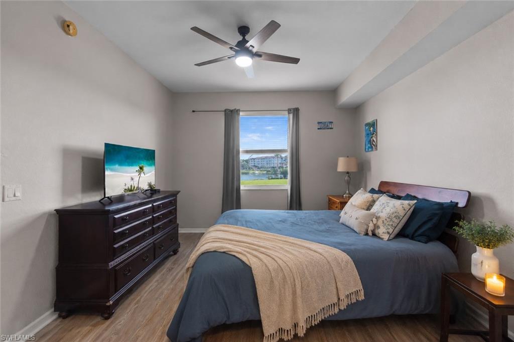 Primary bedroom featuring LVP flooring, and updated ceiling fan