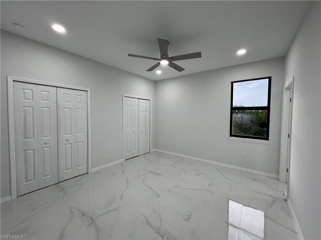 Room featuring large format porcelain tile flooring, a ceiling fan with integrated lighting, and multiple recessed lights