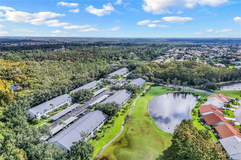 Aerial perspective showcasing multi-unit residential buildings with gray roofs