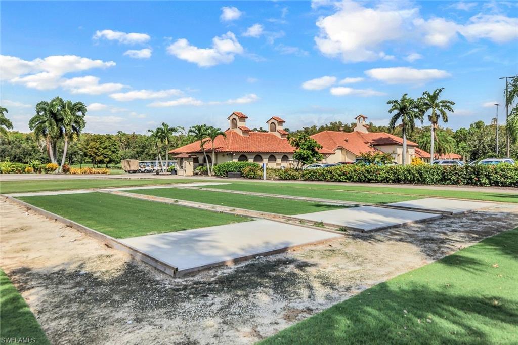 Multiple bocce ball courts featuring synthetic turf surfaces and concrete borders