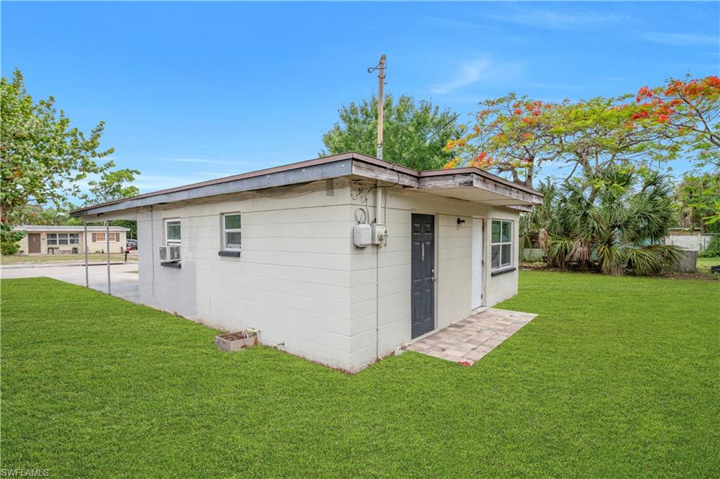 View of side of home and back yard