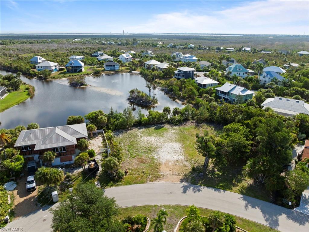 Cleared lot with established street frontage and mature perimeter landscaping