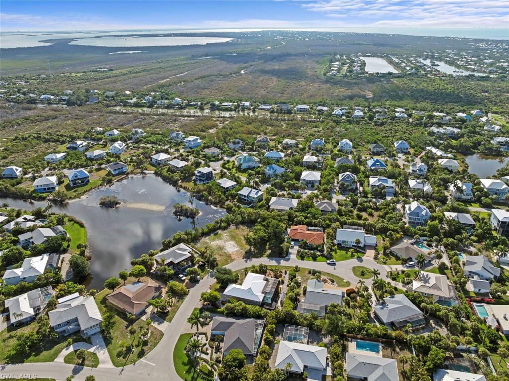 Aerial perspective showcasing a residential community with water features