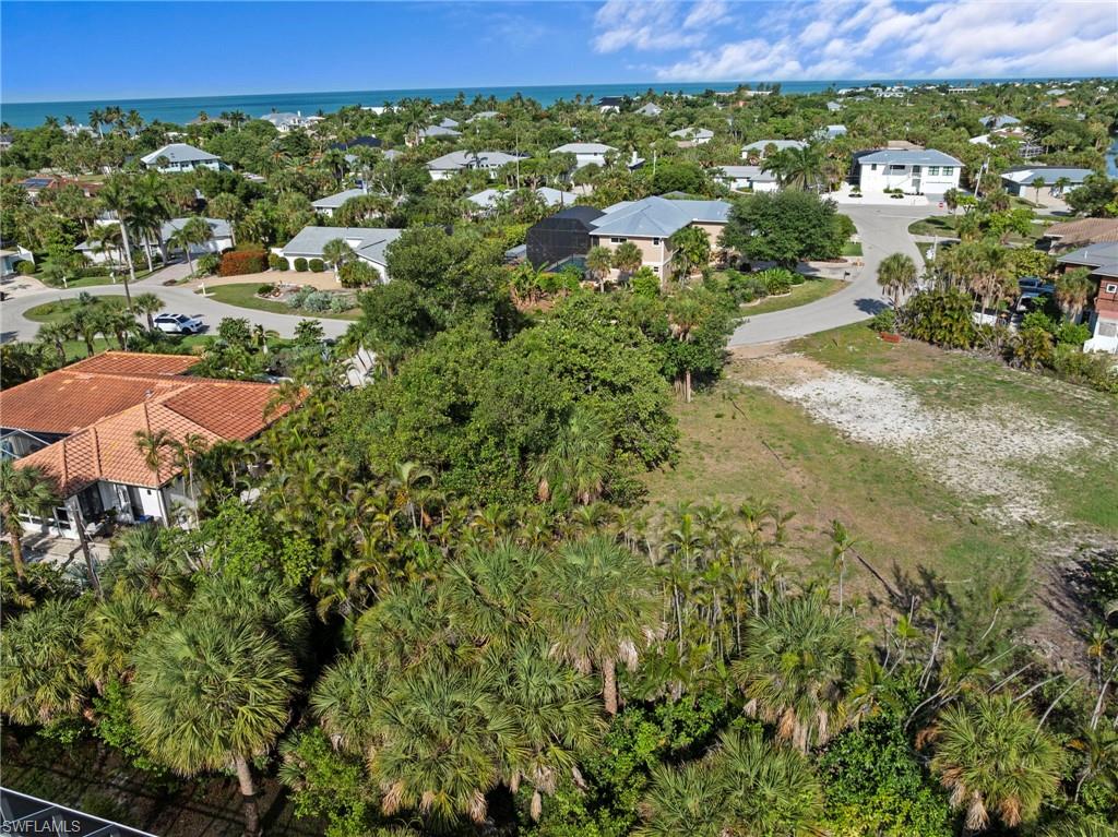 Expansive undeveloped lot featuring partial tree coverage and clear areas