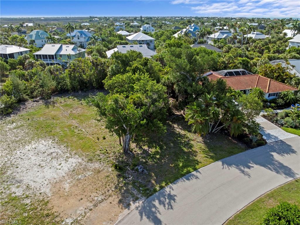 Expansive land parcel featuring partial vegetation and a clear building area