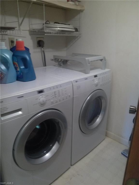 Washroom featuring electric dryer hookup and washer and dryer