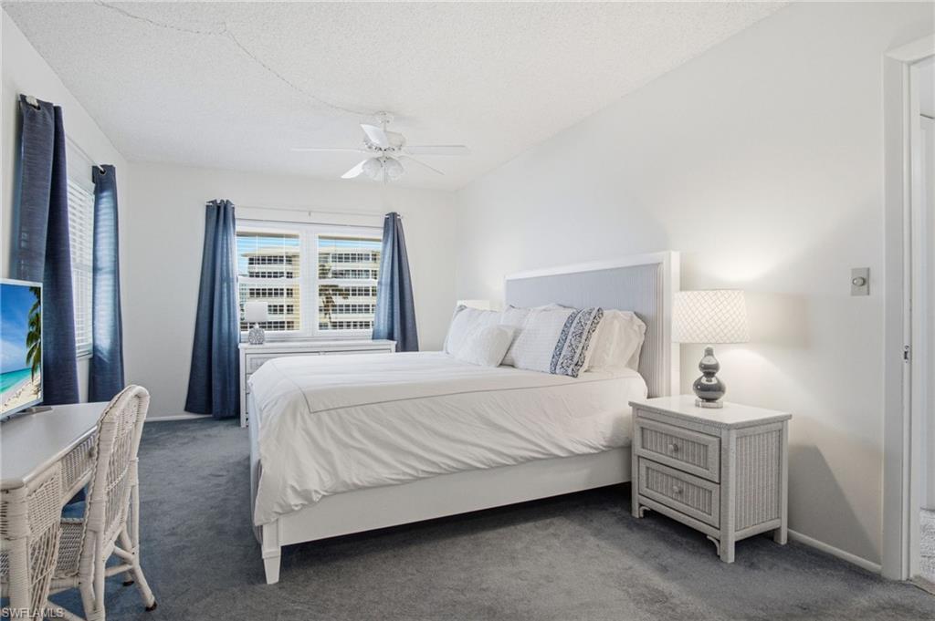 The spacious primary suite has beautiful bay views, a large walk-in closet, and an ensuite bathroom.