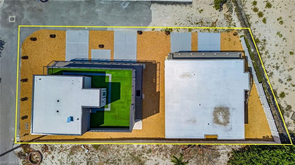 Aerial perspective showcasing two structures with flat roofs