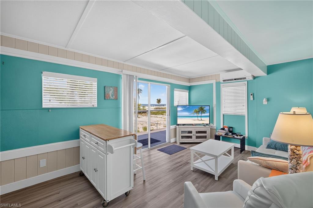 2401 Cottage Ave Unit 2 - Sliding glass doors opening to an exterior deck and coastal scenery